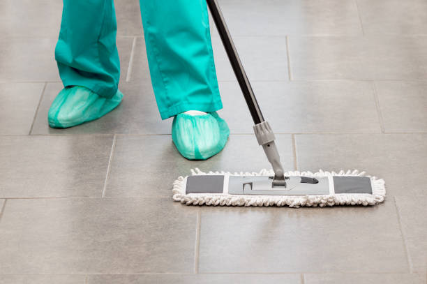 cleaning services with washing mop in sterile operating room Floor care and cleaning services with washing mop in sterile operating room or clean hospital facilities protection services stock pictures, royalty-free photos & images