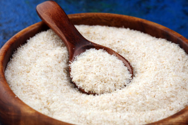istock Portion of Psyllium Seeds on rustic dark background. Psyllium seed husks on wood 1201503615