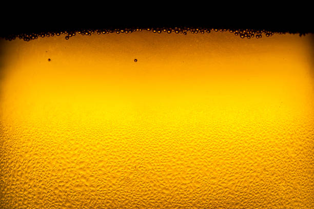 istock water drops on beer background,Drops on the glass,Bottle with a cold drink 1201505265
