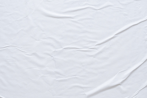 Fondo de textura de póster de papel arrugado y arrugado blanco en blanco photo