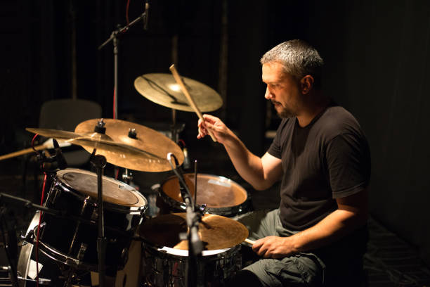 istock Drummer playing drums in the music recording studio 1201505360