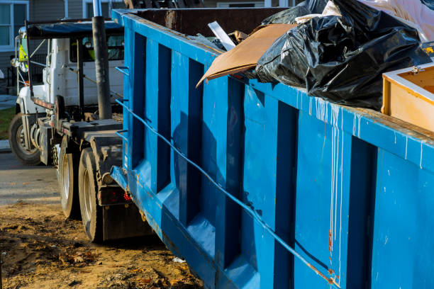 Loading the garbage container old and used construction material in the new building construction work site. Loading the garbage container construction material and used in the container new building frame of a new house under construction junk removal truck stock pictures, royalty-free photos & images