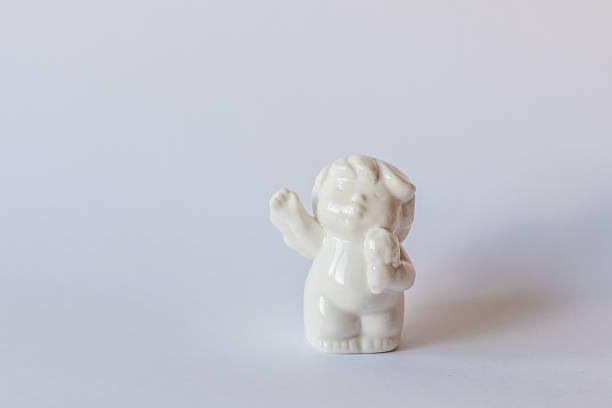 istock Ceramic figurine on a blue background . Valentine's Day. Selective focus. 1201505558