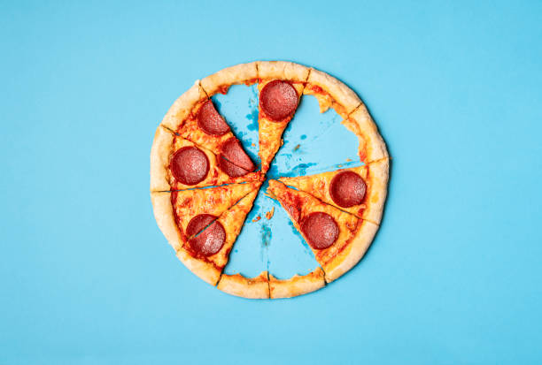 istock Pizza salami with missing slices and leftover crust 1201508325