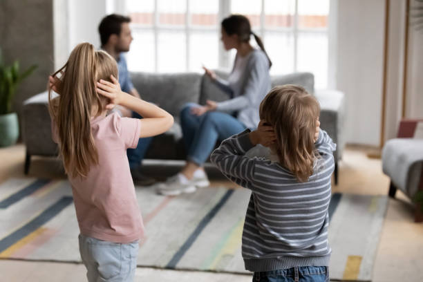 istock Small kids close ears avoid listening to parents fight 1201510306