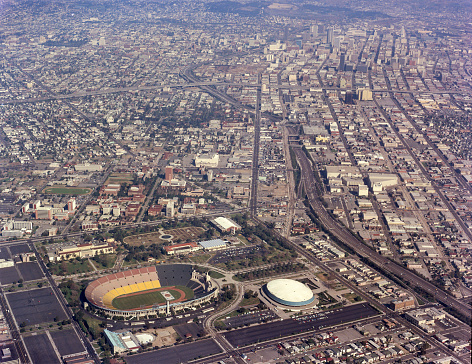 Aerial view from Los Angeles Memorial Coliseum to downtown Los Angeles, California, USA along the 110 freeway in 1970. VIew includes Los Angeles Memorial Sports Arena and USC (University of Southern California) campus.