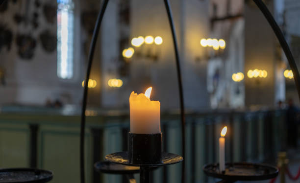 istock Candle in the church 1201510616