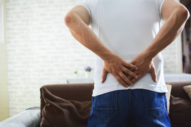 istock Man portrait feeling bad for painful backache 1201510709