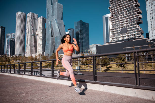 istock Sporty woman running 1201510877