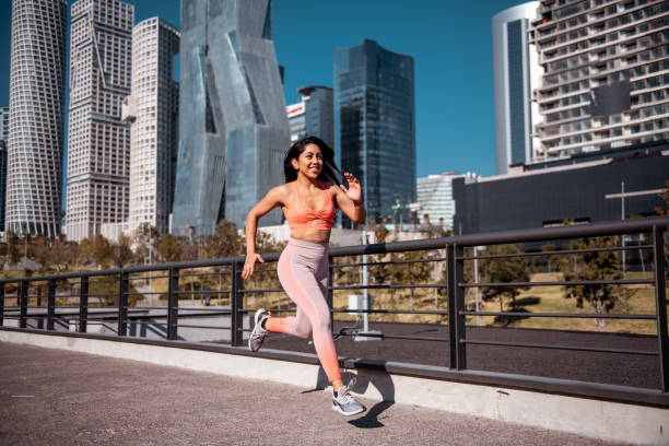 istock Sporty woman running 1201511439