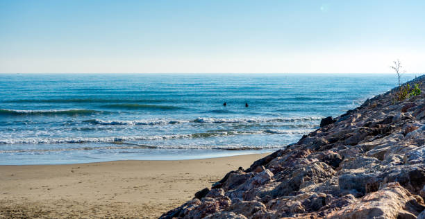 istock Man surfing in the Mediterranean Sea 1201515716