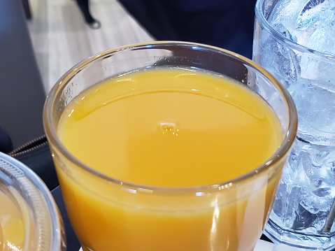 Clear drinking glass with yellow liquid, November 17, 2019