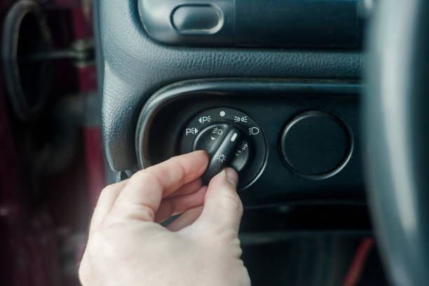 istock hand switching old and dusty knob for lights 1201517444