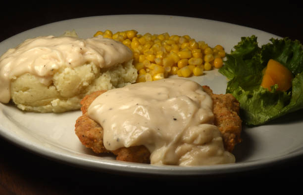 istock Country Fried Steak with Mashed Potatoes Await 1201518471