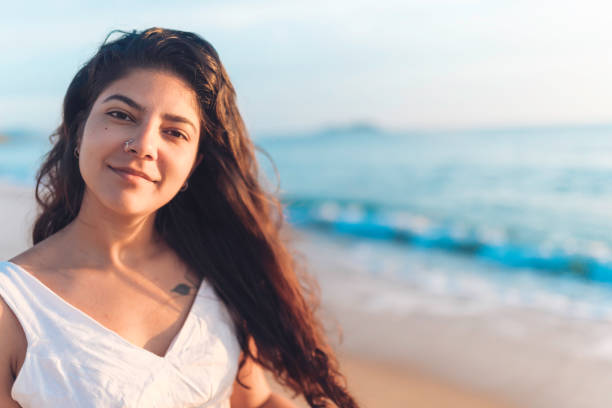 istock Happy woman on the beach 1201518482