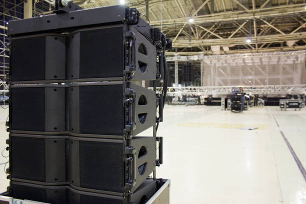 istock Flight cases with line array speakers. Installation of professional sound, light, video and stage equipment for a concert. 1201519777