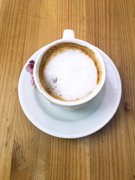 istock Coffee cup on the wooden desk 1201522669
