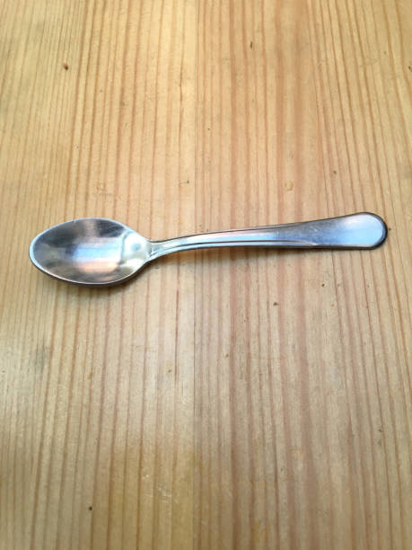 istock Stainless steel tea spoon on wooden 1201523695