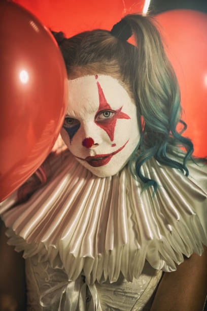 istock Young woman with Joker make-up 1201525032