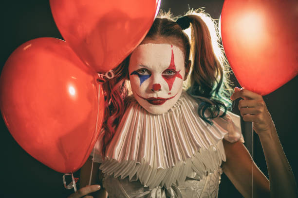 istock Young woman with Joker make-up 1201525055