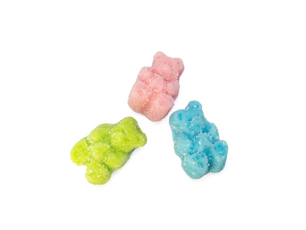 CBD infused medicinal sour candy gummies used for healing Colorful set of 3 CBD infused medicinal sour candy gummies used for healing on a plain white background cannabis gummy bears stock pictures, royalty-free photos & images