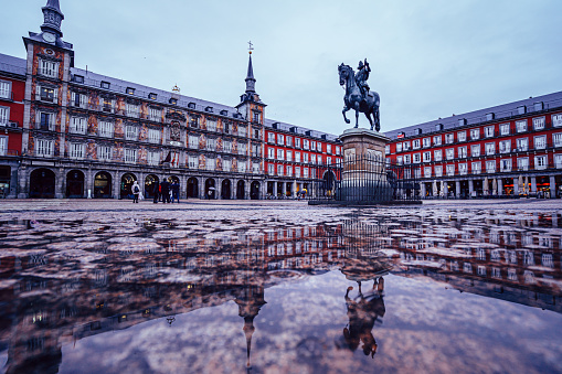 Plaza Mayor of Madrid after the storm, reflected on the ground.