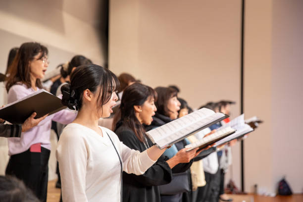 Rehearsal of women's chorus concert Rehearsal of women's chorus concert camel colored photos stock pictures, royalty-free photos & images