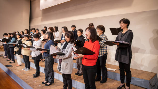 istock Women's chorus members relaxing during rehearsal 1201530289