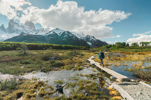 Young Caucasian woman hiking near  Fitz Roy mountain in Patagonia