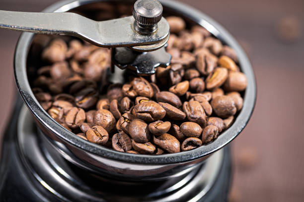 istock The fried coffee beans lie in a coffee grinder. Arab coffee is prayed in a mechanical coffee grinder. Morning coffee. 1201531547