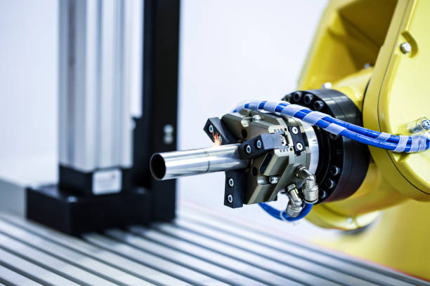 Robotic programmed robot arm. Industrial exhibition of machine tools. Processing and laser cutting for metal in the industrial area. stock photo