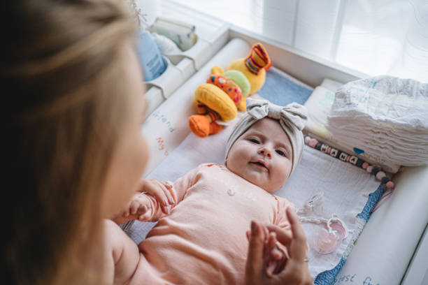 istock Cute baby spending time with mom 1201538736