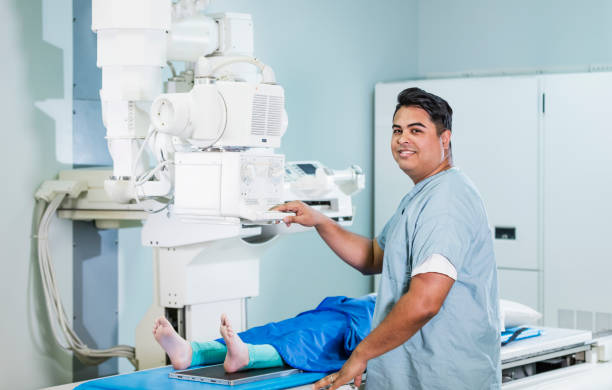 istock Technologist taking x-ray of girl's foot 1201541702