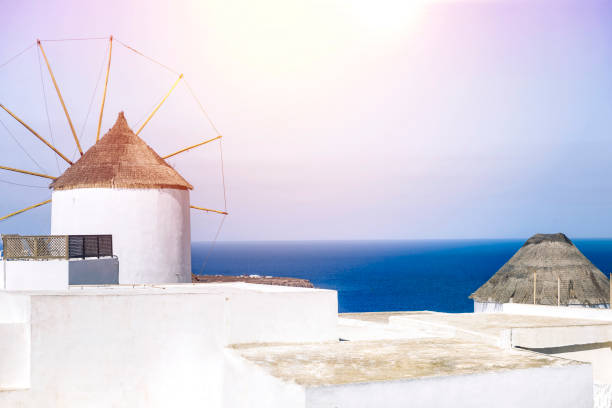 Windmill on Santorini island, Greece, Oia. Aegean sea view. Copy space