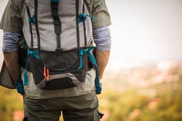istock Midsection of a backpack wore by a person in front of a viewpoint 1201544796