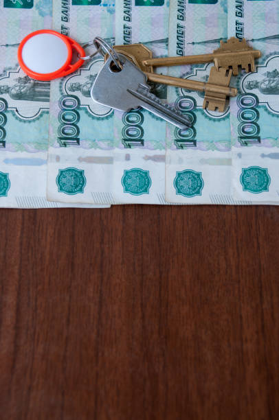 istock On the table is a bunch of keys and Russian banknotes worth a thousand rubles 1201553059