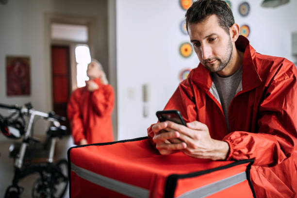 istock Food delivery couple getting ready for work 1201556054