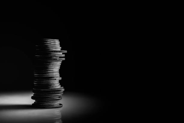 Coins stack on black Coin stack black and white on black background, finance concept. currency photos stock pictures, royalty-free photos & images