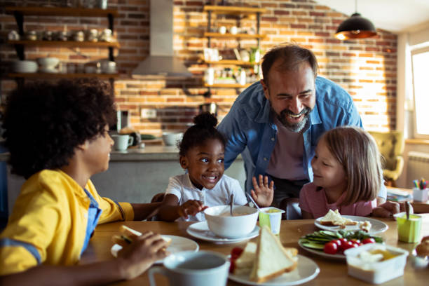 istock Single father having breakfast with his kids 1201561551
