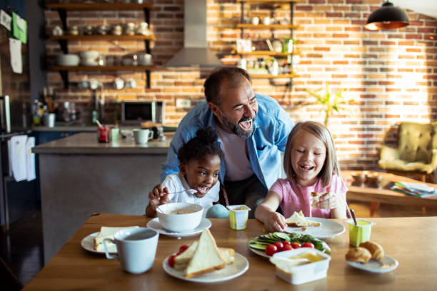 istock Single father having breakfast with his kids 1201562926
