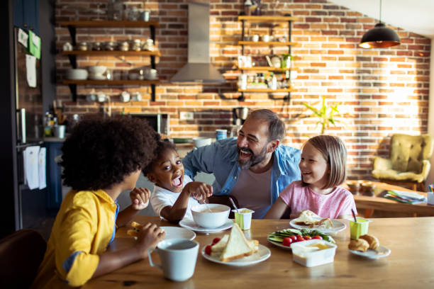 istock Single father having breakfast with his kids 1201563764