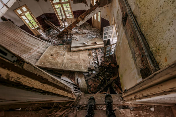 istock collapsed floor in an abandoned building 1201564874