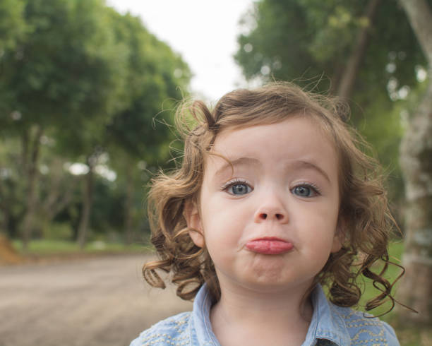 istock Cute young girl pouting on the road 1201568511