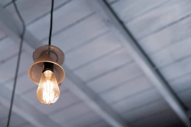 istock vintage retro design lamp hang on ceiling background. 1201572459