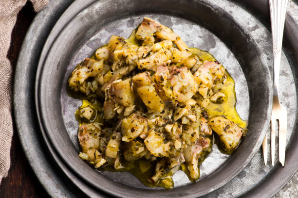 istock Herring salad with garlic, herbs and olive oil 1201575228