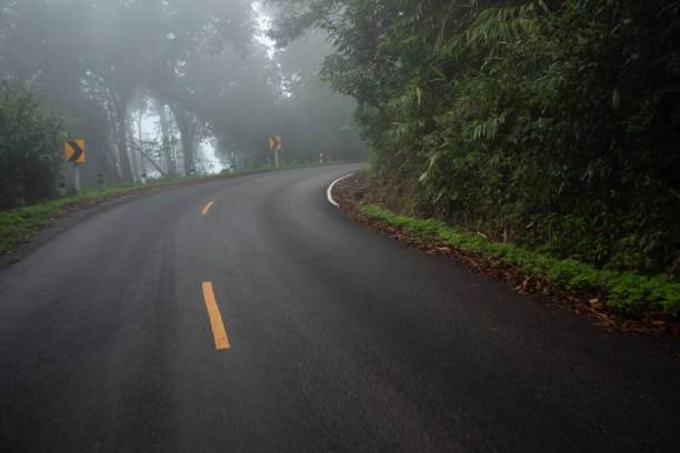 istock Foggy road on the mountain. 1201577141