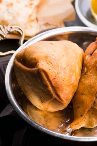 istock Veg Samosa - is a crispy and spicy Indian triangle shape snack 1201577282