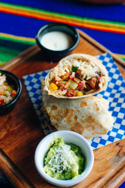 istock Vegetarian breakfast burrito with eggs and rice, sauces. 1201577622
