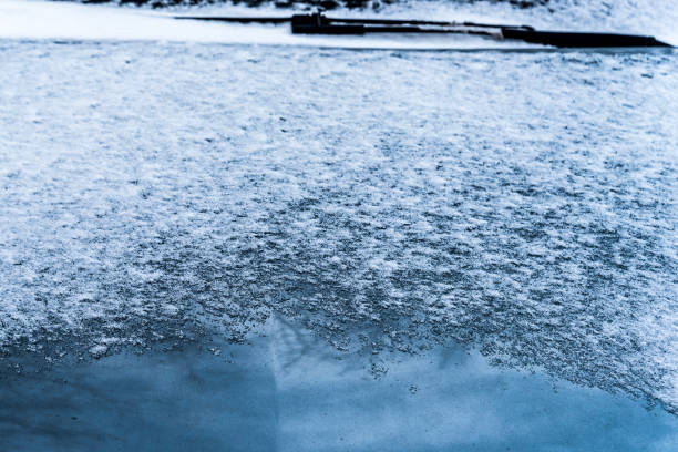 istock Snow on a car hood as a background. 1201584173