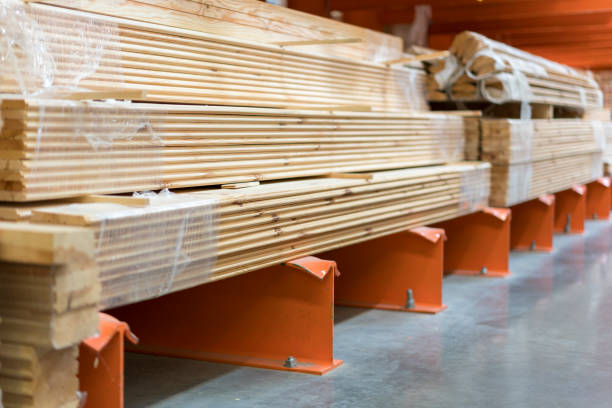 istock Boards on a rack in a construction store. Construction and repair concept 1201592382